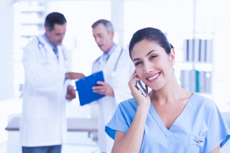 smiling-femal-doctor-phoning_13339-139381